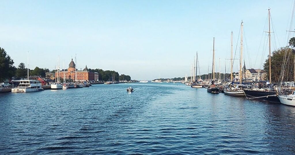 Boats and yachts docked in a scenic harbor view